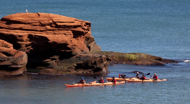 Paddling by the sandstone cliffs
