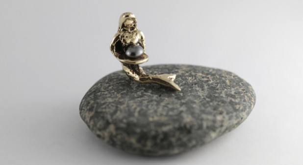 brass mermaid with stone