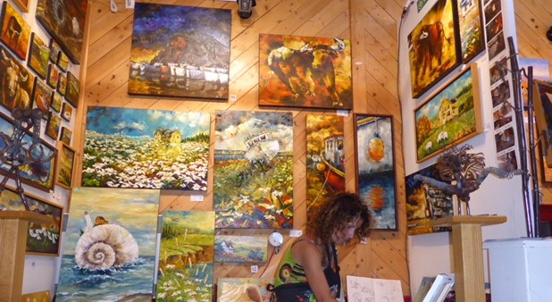 The artist surrounded by her paintings