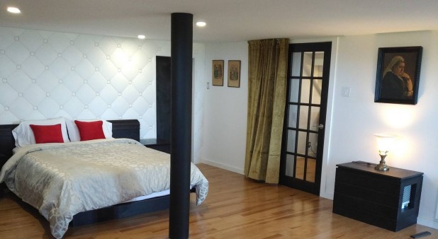 Master bedroom, very spacious with view on the sea + direct access to outside, large walk in, we call it the private suite
