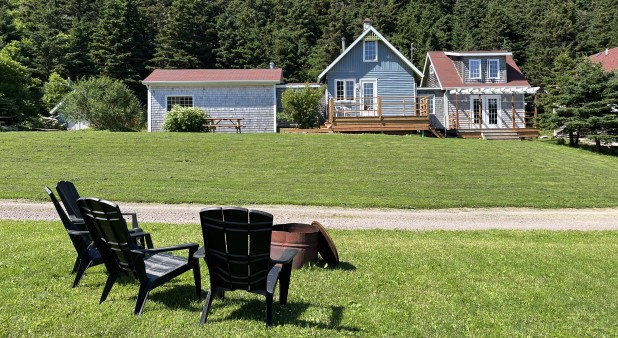 Iles de la Madeleine Vacation House_La repousse front view chairs firepit