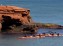 Paddling by the sandstone cliffs