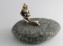 brass mermaid with stone