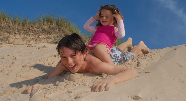 Kids playing on the beach at Pointe-aux-Loups