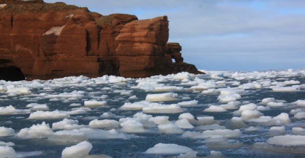 Magdalen Islands, red cliff, sea, ice floe, winter