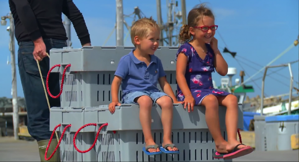 Children on the lobter crates